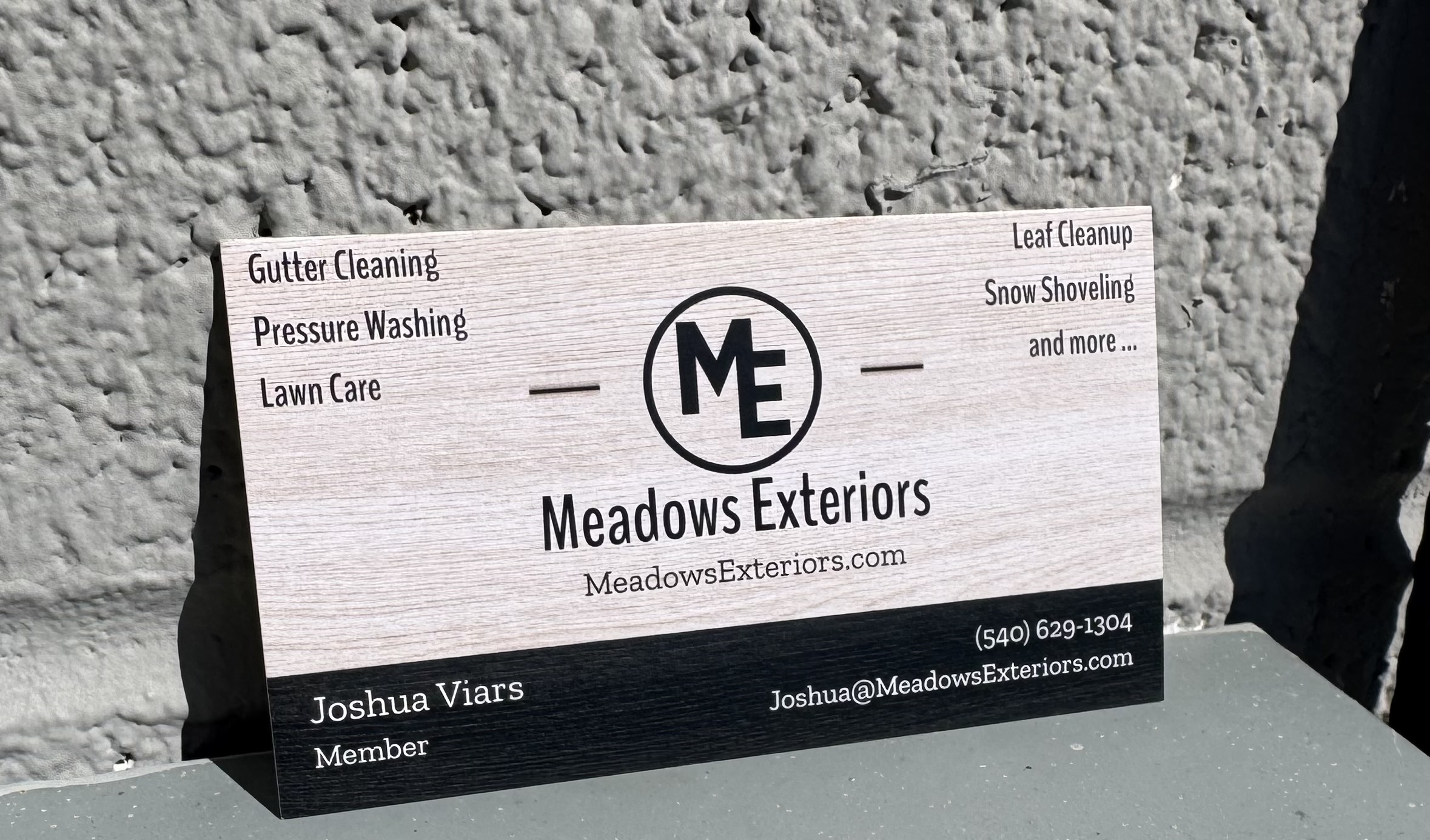Meadows Exteriors professional business card featuring company logo, services, and Joshua Viars contact information